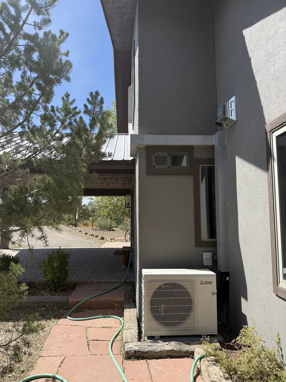 Custom fabricated line set cover down to the outdoor unit
