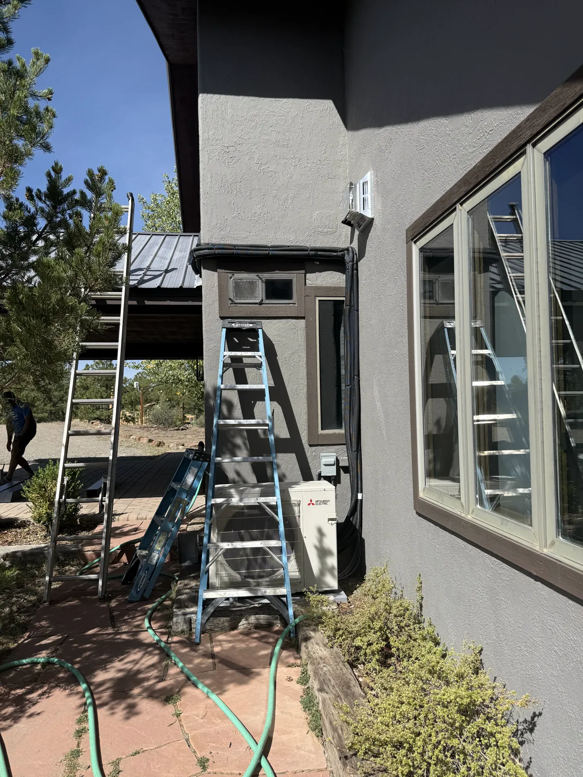 Exposed mini-split line set down to the outdoor unit